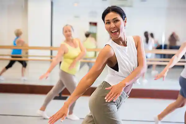 Zumba instructor in class with Senior students participating