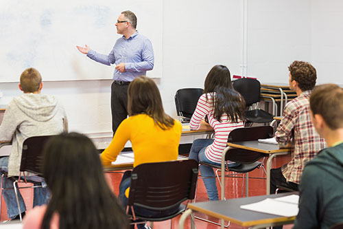 Card image Instructor teaching young students in class