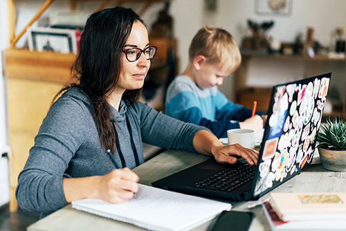 Card image mother with child studying online