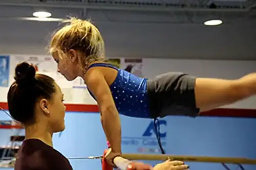 Card image little girl on uneven bars
