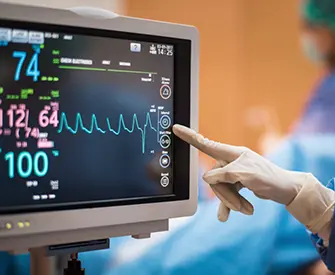 This image shows a patient monitoring system, commonly referred to as a bedside monitor or cardiac monitor, used in clinical settings like operating rooms or ICUs. 