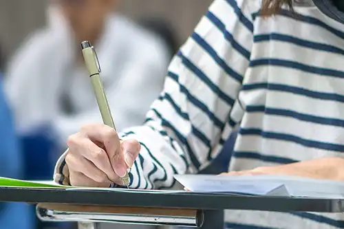 Female Student taking Requirement Exam