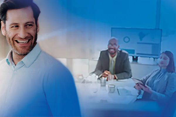 Confident business man smiling, with an overlaid translucent view of a modern meeting in the back.