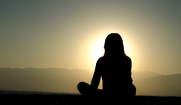 Woman meditating web