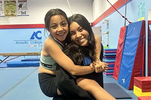 Second slide an AC gymnastics coach and a young student