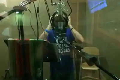 Recording Arts - Male singing into overhead mic