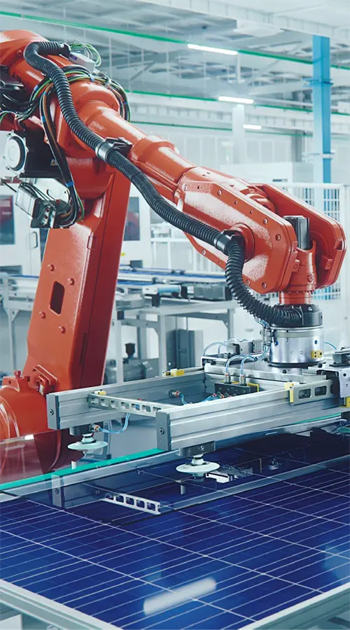 male working on programable robotic arm