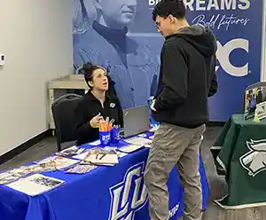 picture of student talking to a recruiter at a transfer fair
